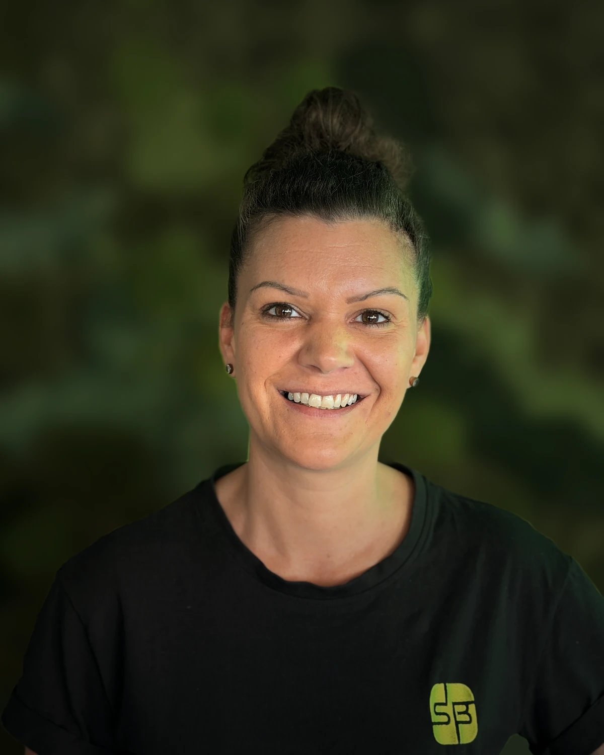 Jenny in front of the moss wall in the SB-Elektronik office